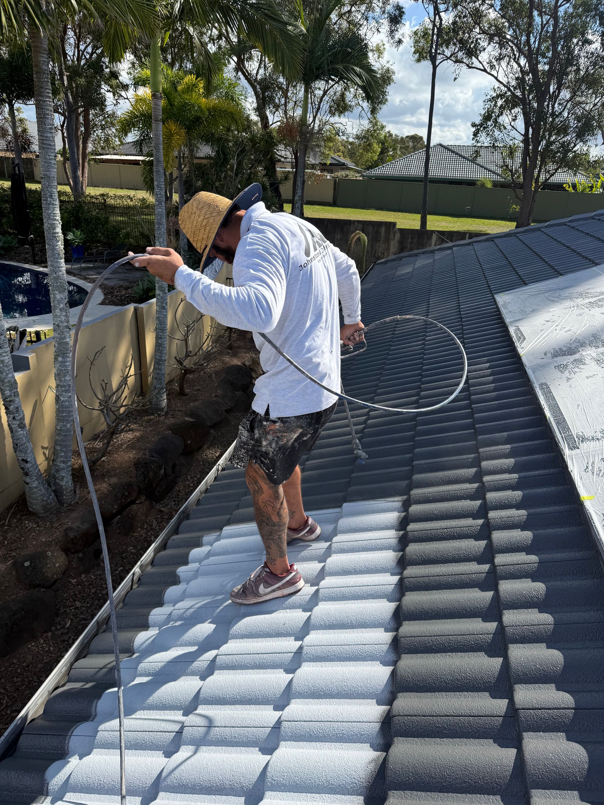Spray gun Painting on roof — Roof Painting in Southport QLD