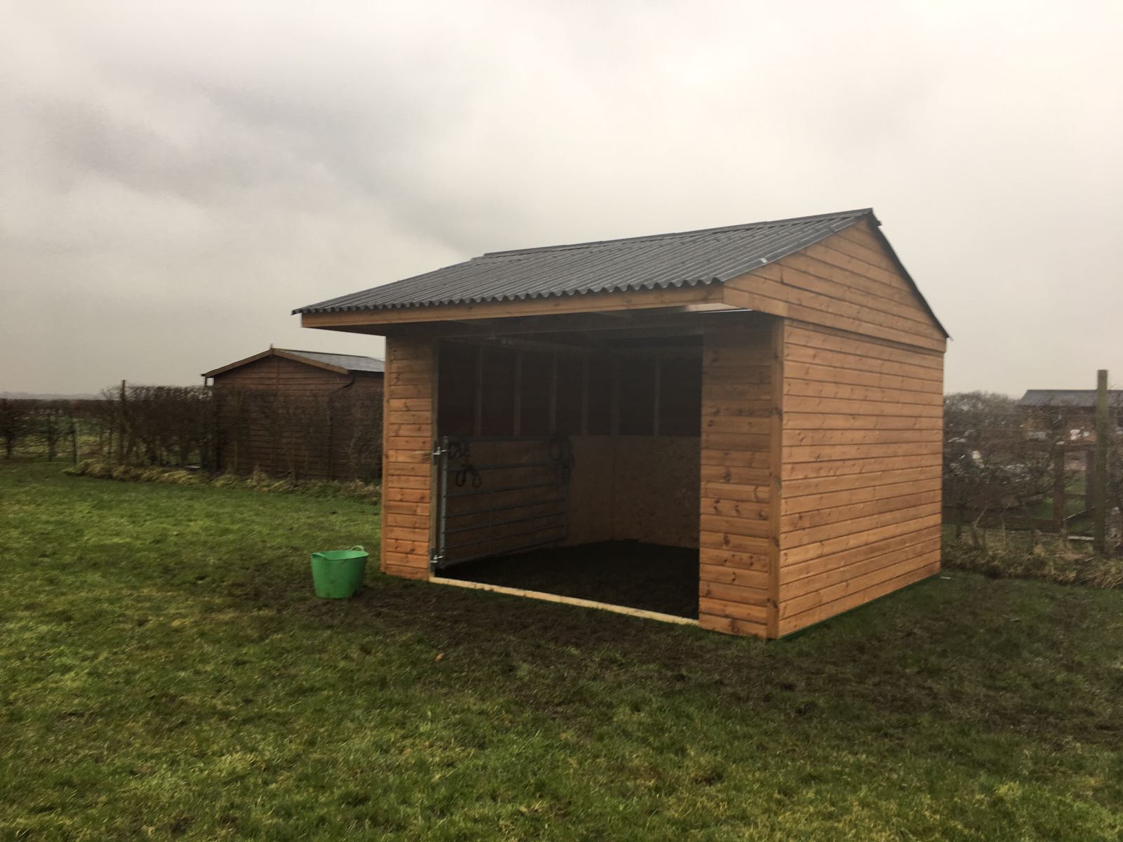 wooden field shelter for a horse