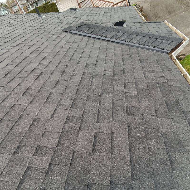 A close up of a roof with shingles on it.