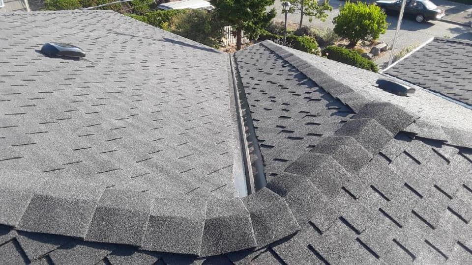 A close up of a roof with shingles on it.