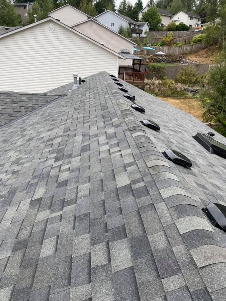 The roof of a house with a lot of shingles on it.