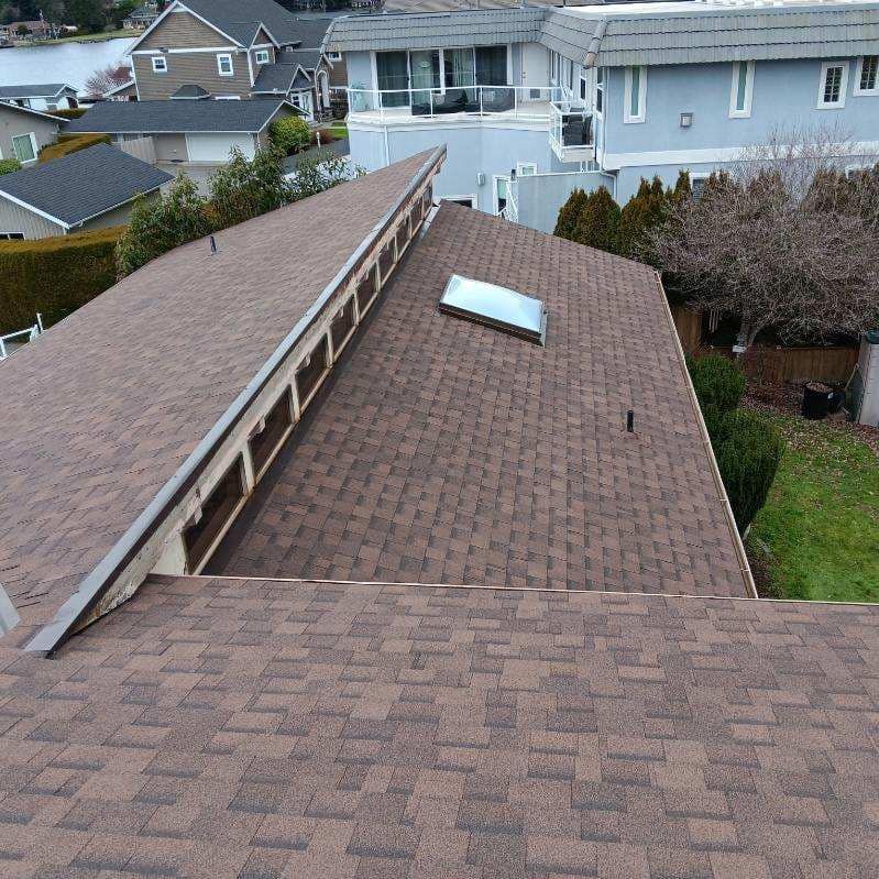 The roof of a house has a skylight on it
