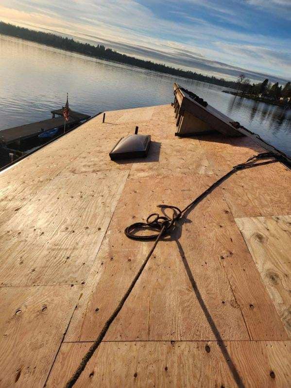 A wooden roof with a view of a body of water.