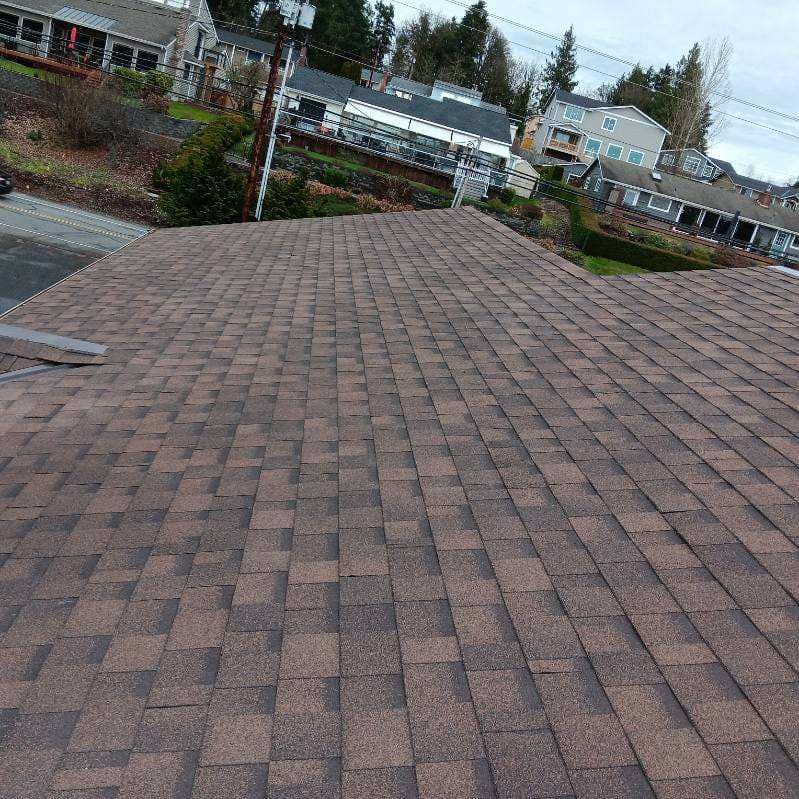 A close up of a roof with a lot of shingles on it.