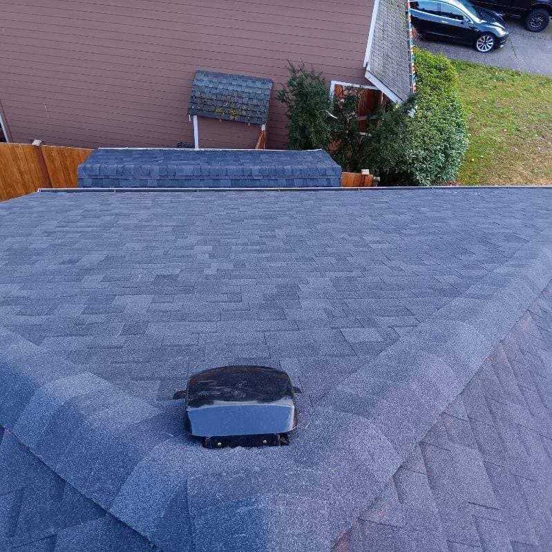 An aerial view of a roof with a vent on it.