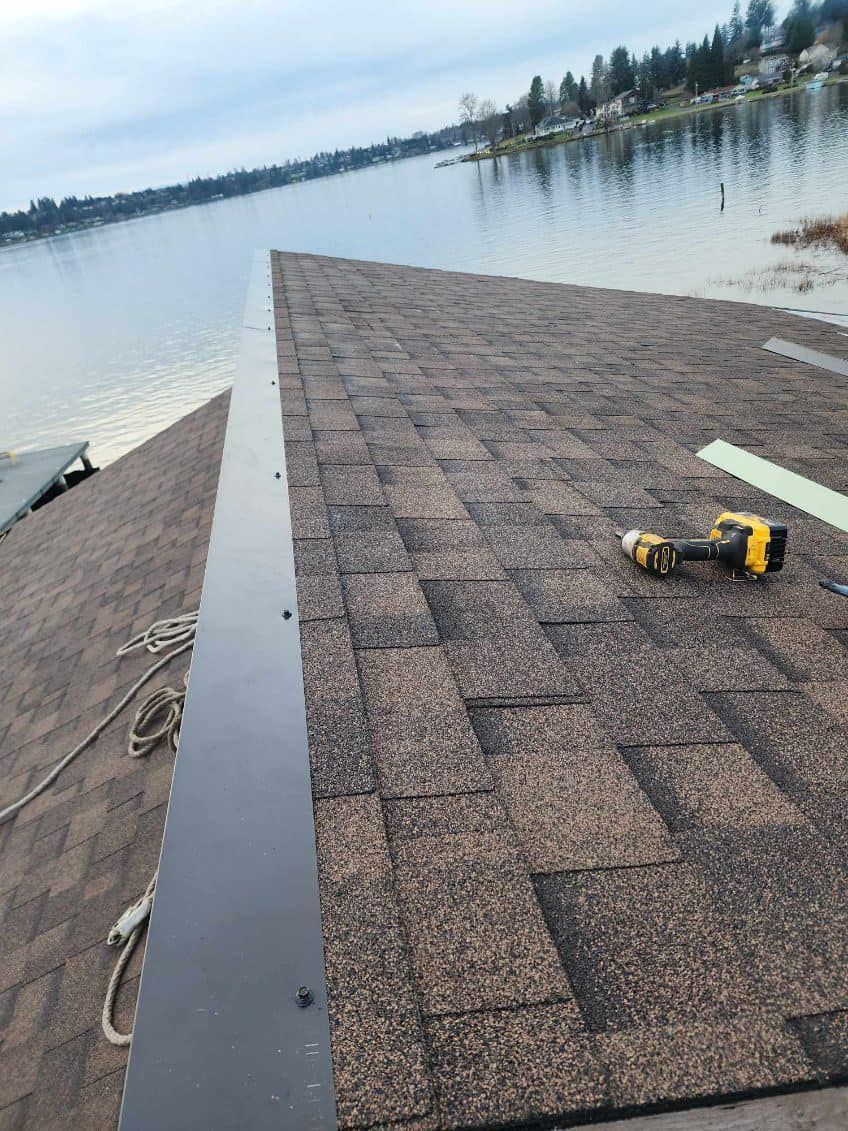 A roof is being built next to a body of water.