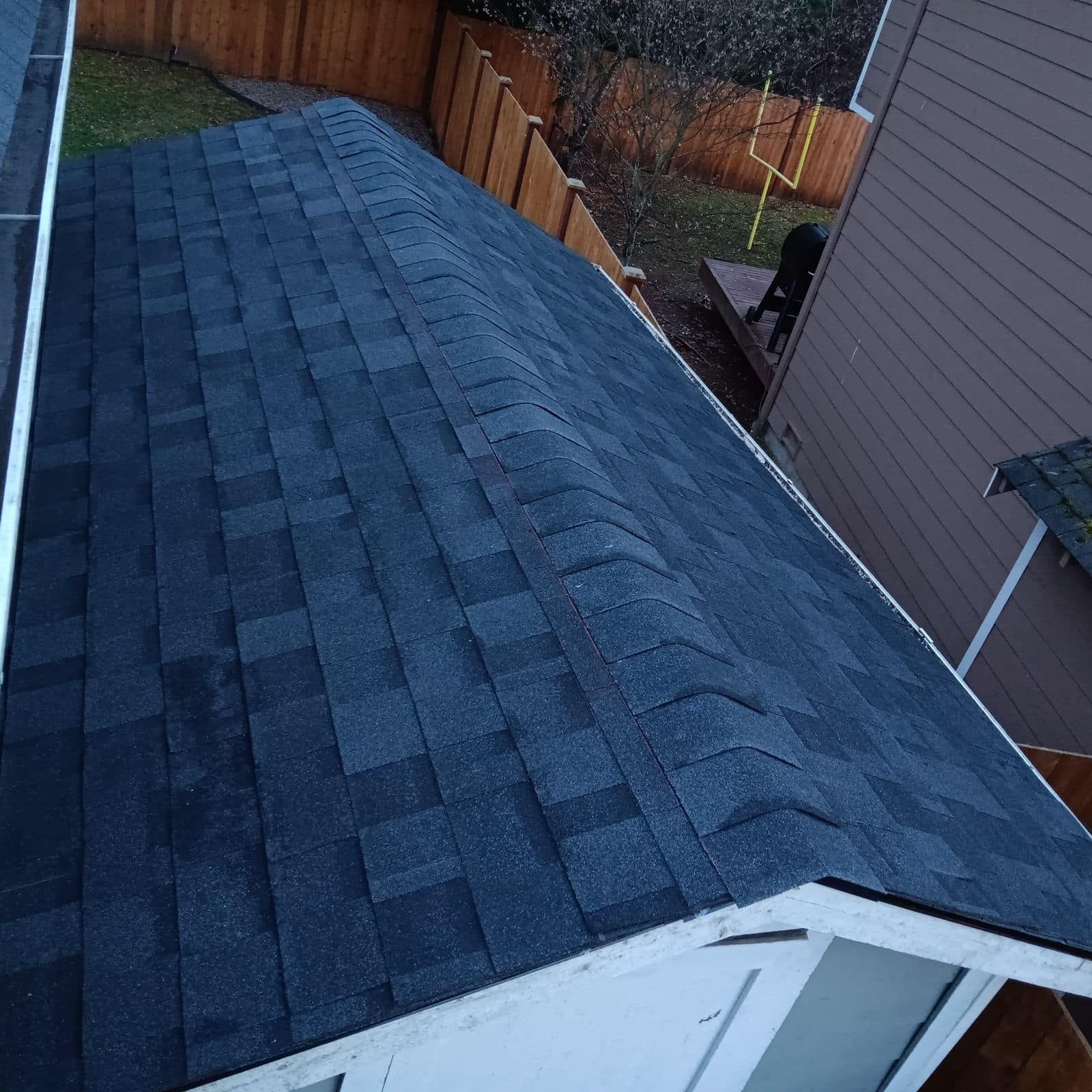 An aerial view of a roof with shingles on it
