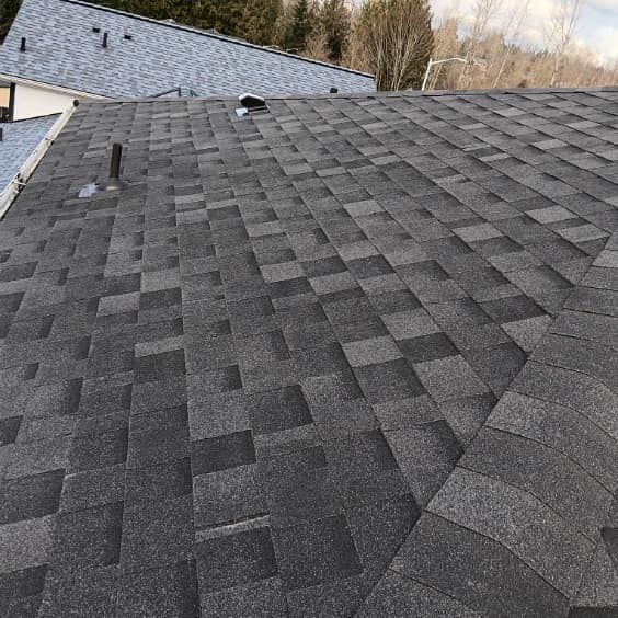 A close up of a roof with shingles on it.
