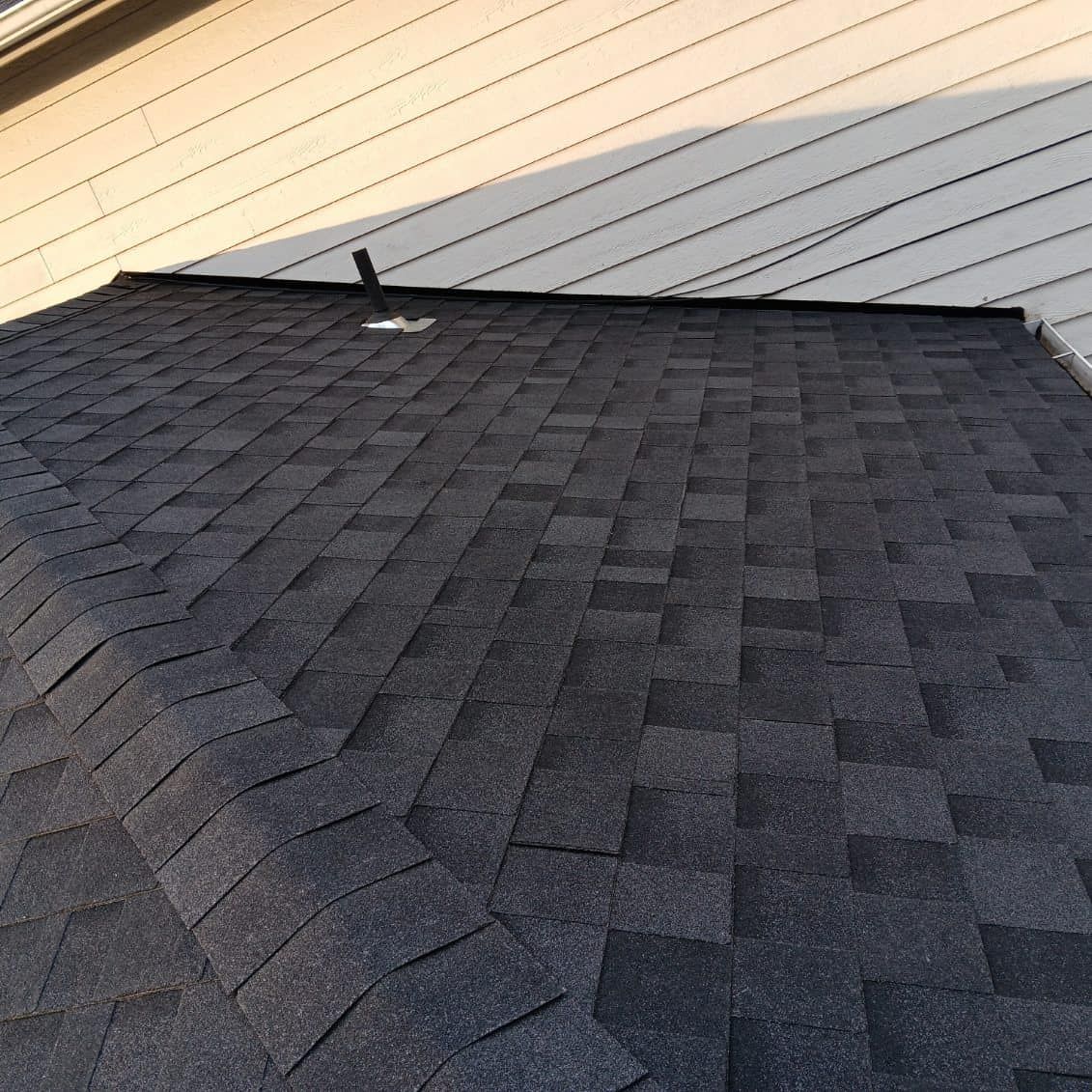 A close up of a roof with shingles on it.