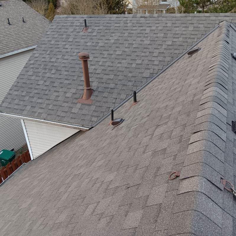 A close up of a roof with a chimney on it