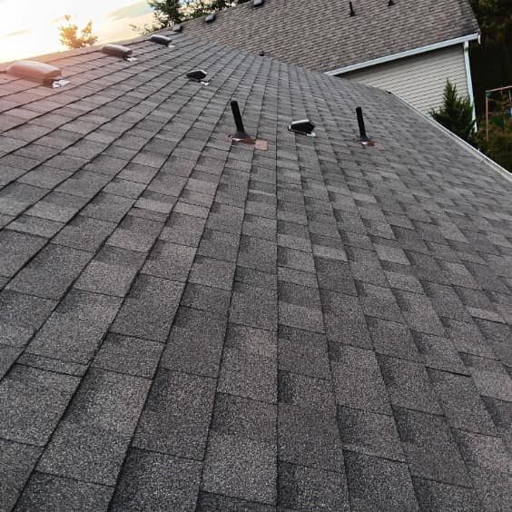 A close up of a roof with a lot of shingles on it.