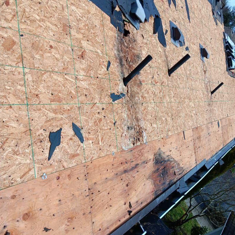 A roof that is being repaired with a lot of plywood on it
