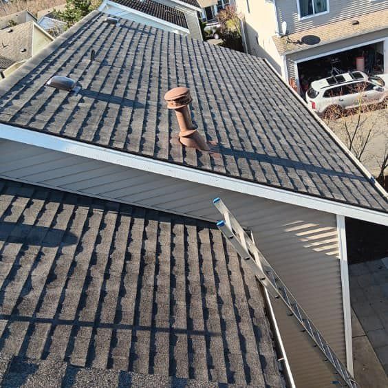 An aerial view of a roof with a ladder on it