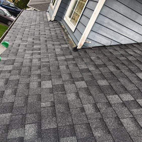 A close up of a roof of a house with shingles on it.