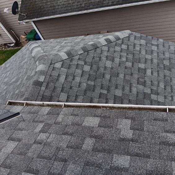 A close up of a roof with shingles on it.