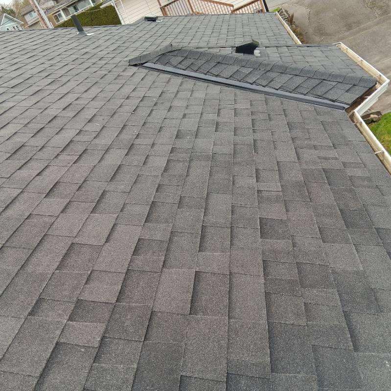 A close up of a roof with shingles on it.