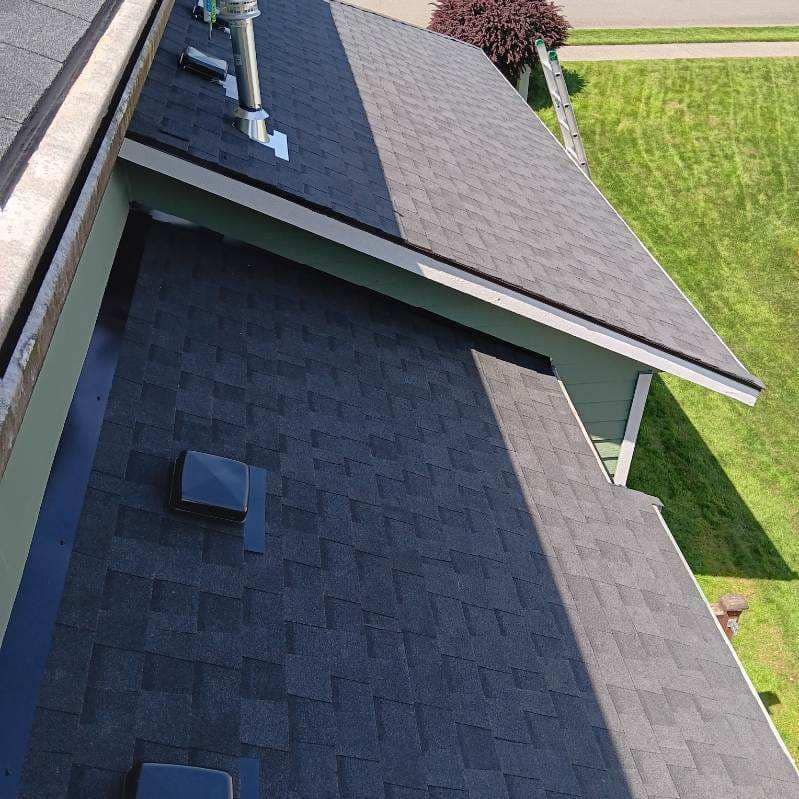 An aerial view of a roof of a house with a chimney on it.