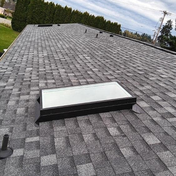 A roof with a skylight on top of it.