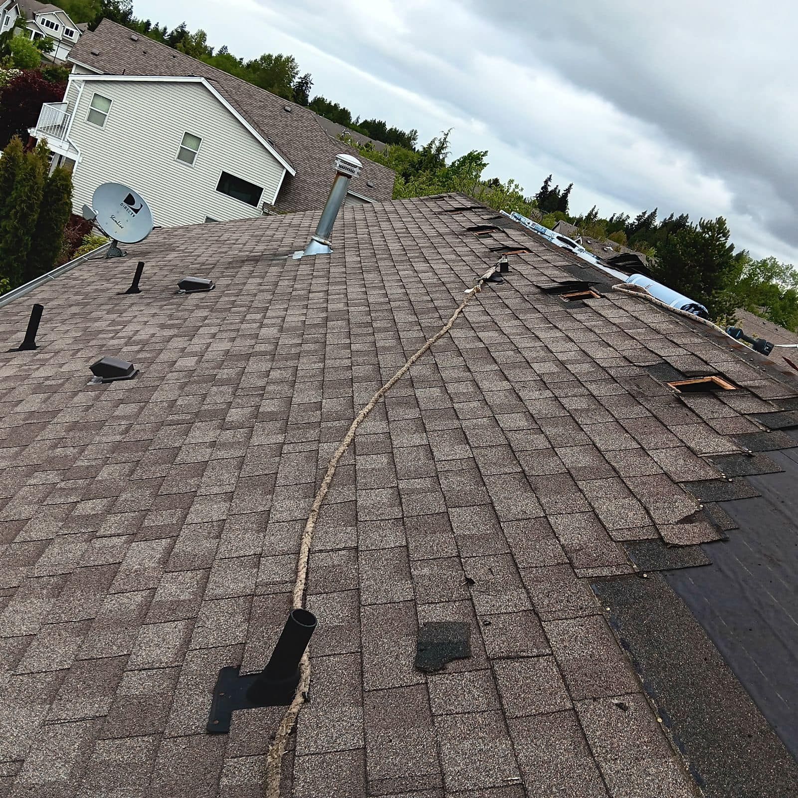 A roof with a satellite dish on top of it