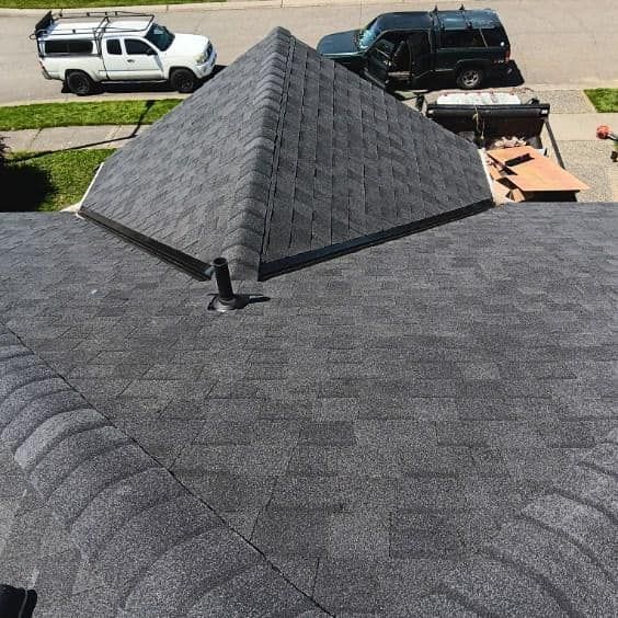 A roof with a pyramid shaped roof and a truck parked on it.