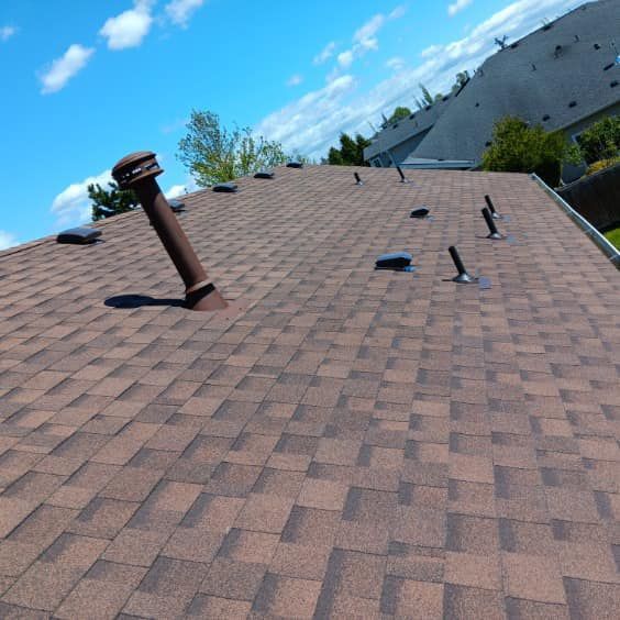 A brown roof with a chimney on top of it
