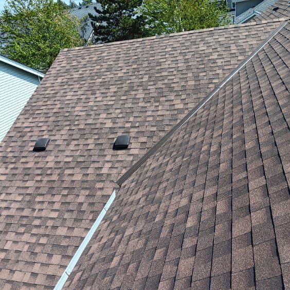 A close up of a roof with shingles on it