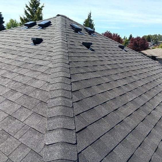 A close up of a roof with a lot of shingles on it.