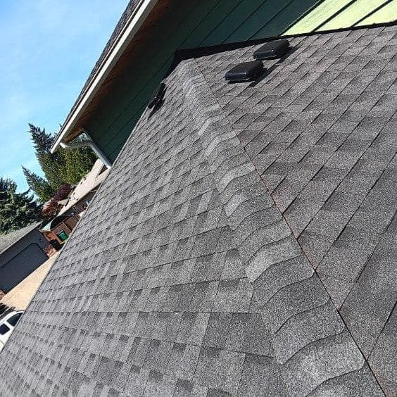 A close up of a roof with shingles on it.