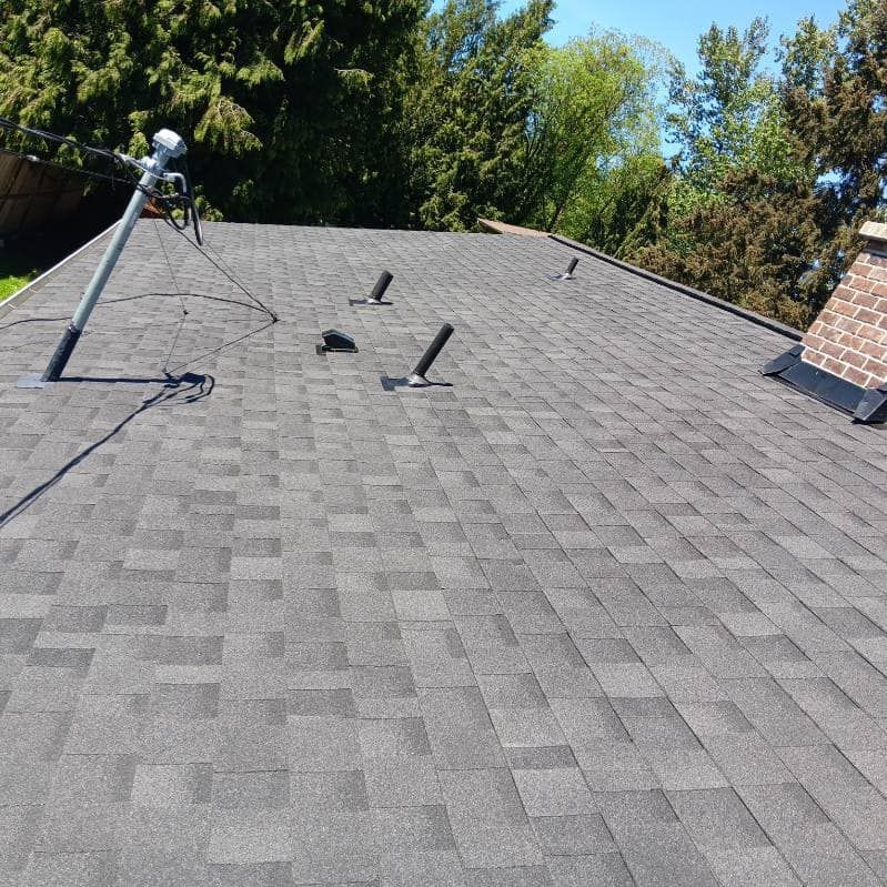 A roof with a satellite dish on top of it.