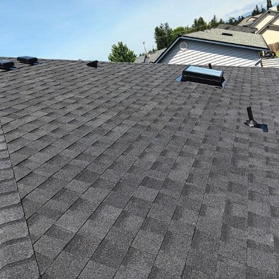A close up of a roof with a skylight on it.