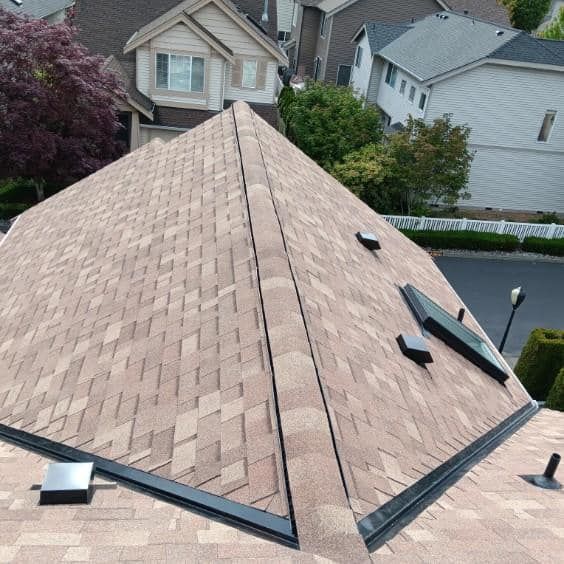 The roof of a house has a pyramid shaped roof