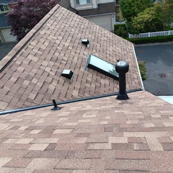 The roof of a house has a skylight on it