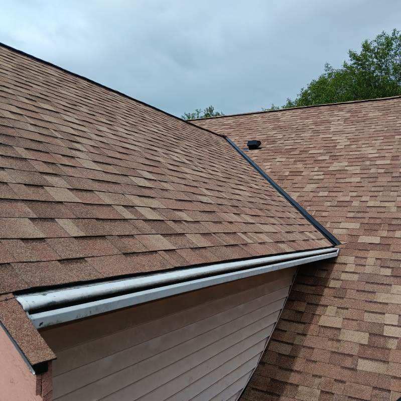 A close up of a roof with shingles on it