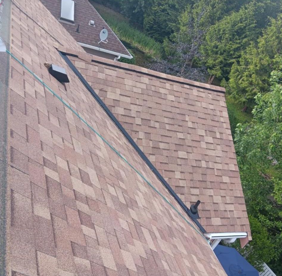 An aerial view of a roof with a satellite dish on it