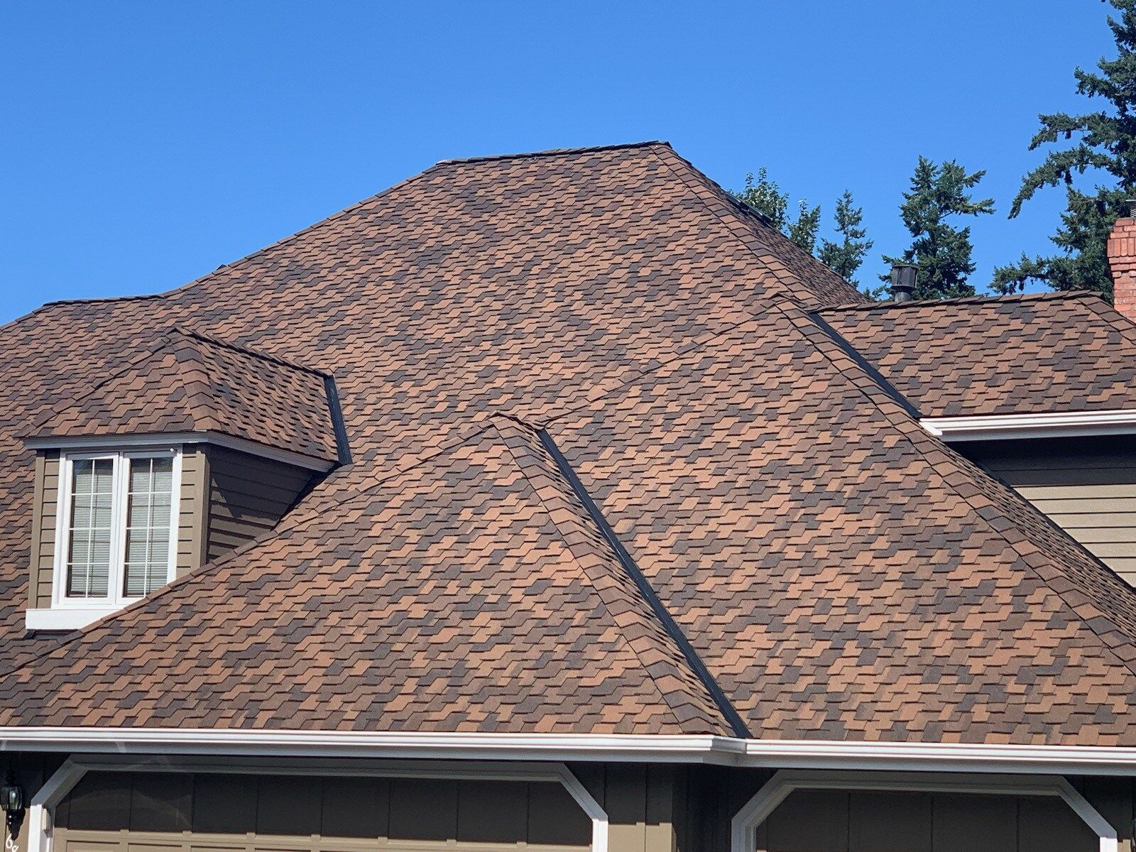 A house with a brown roof and a window