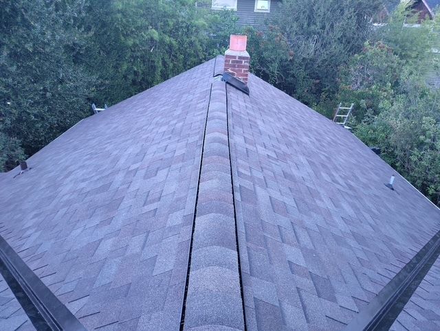 A close up of a roof with shingles on it.