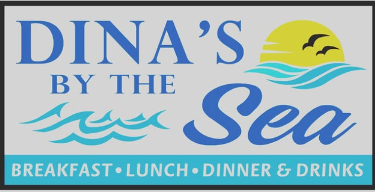 A close up of a plate of seafood paella on a table.