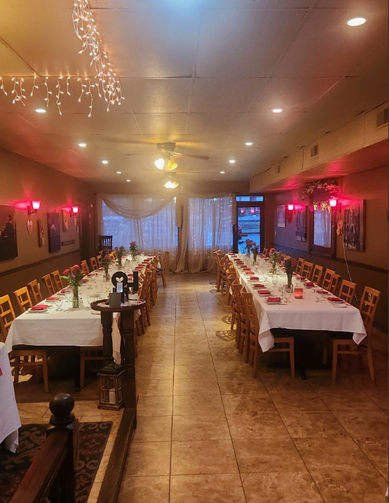 A restaurant filled with tables and chairs and a sign that says relax.