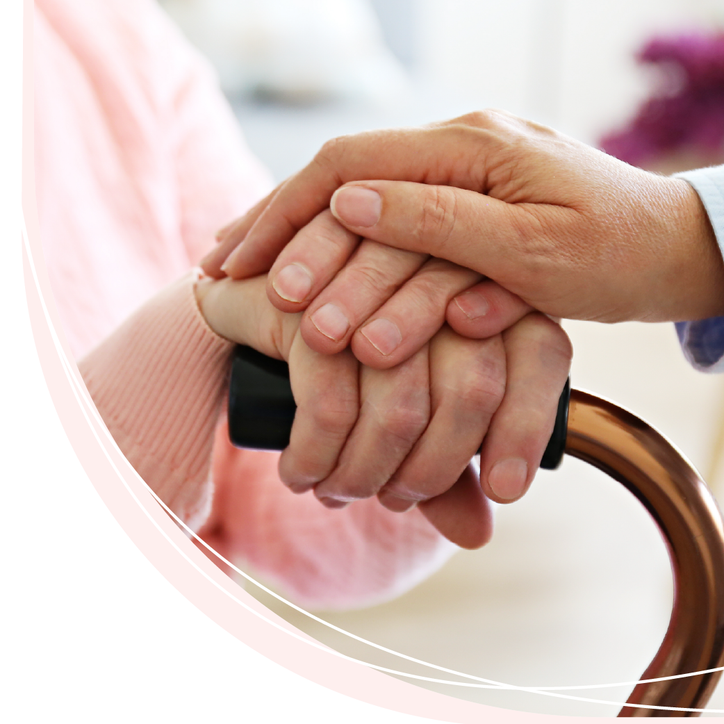 A person holding another person 's hand while holding a cane