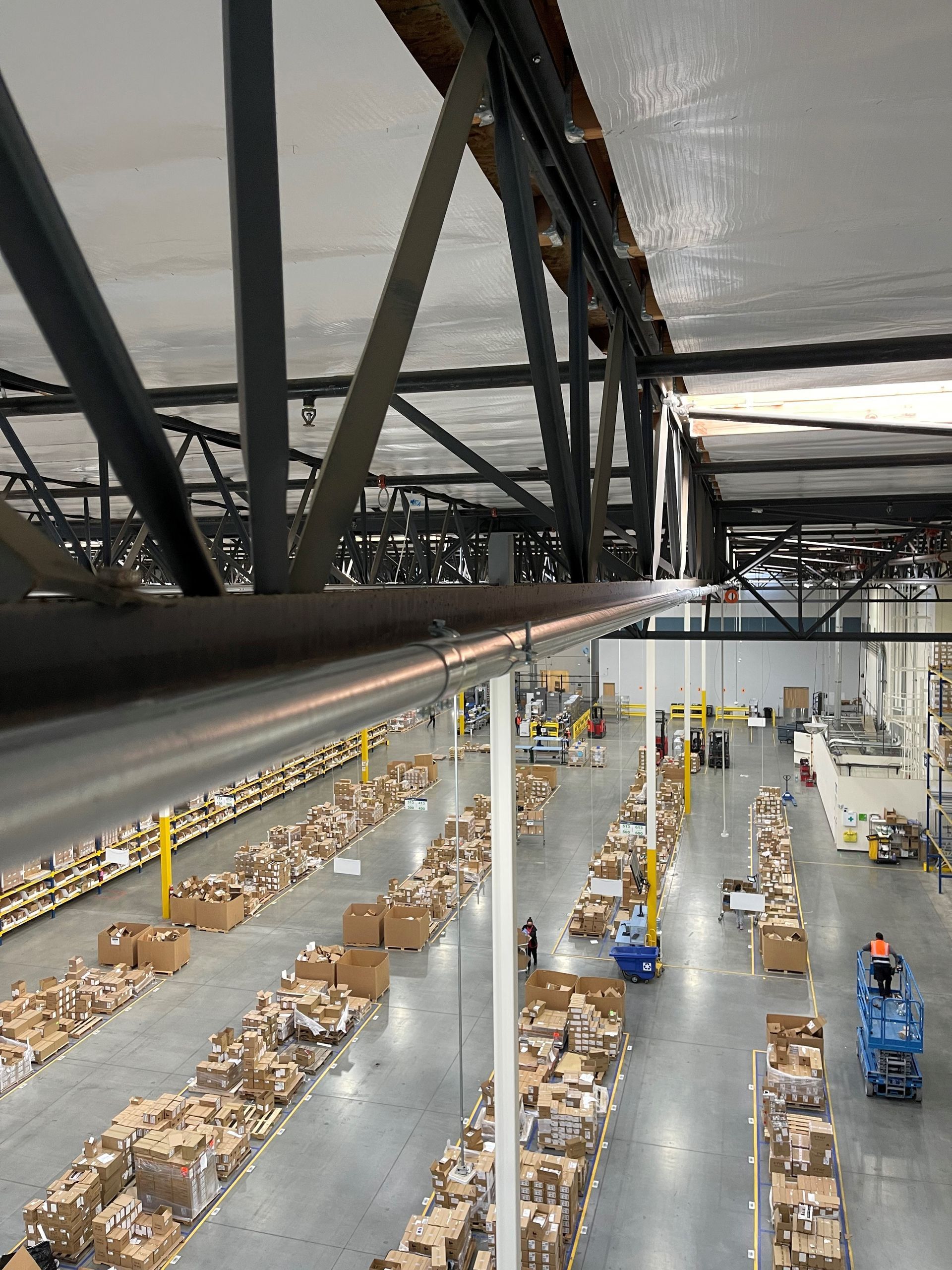 A large warehouse filled with lots of cardboard boxes