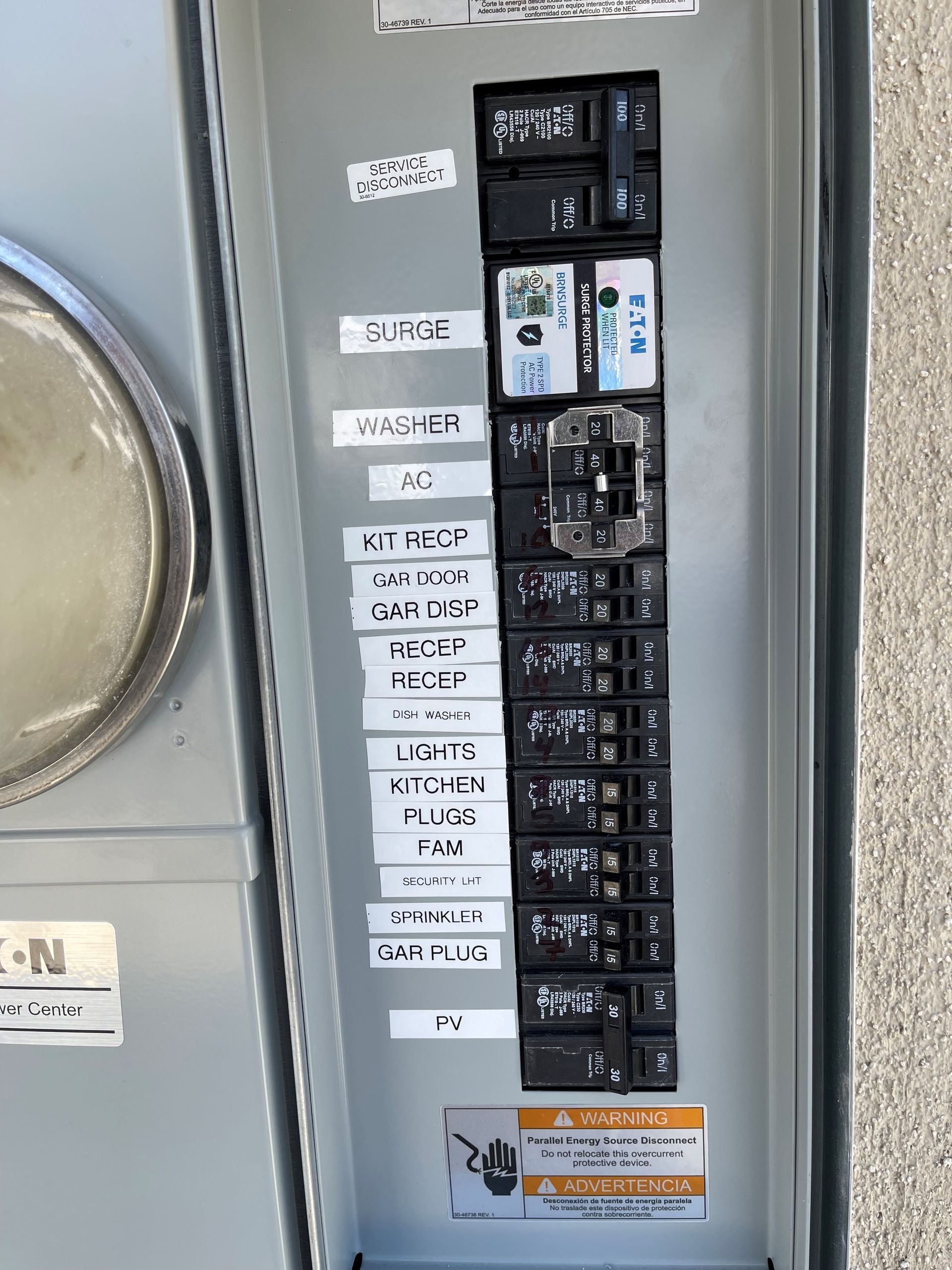 A close up of an electrical panel with labels on it