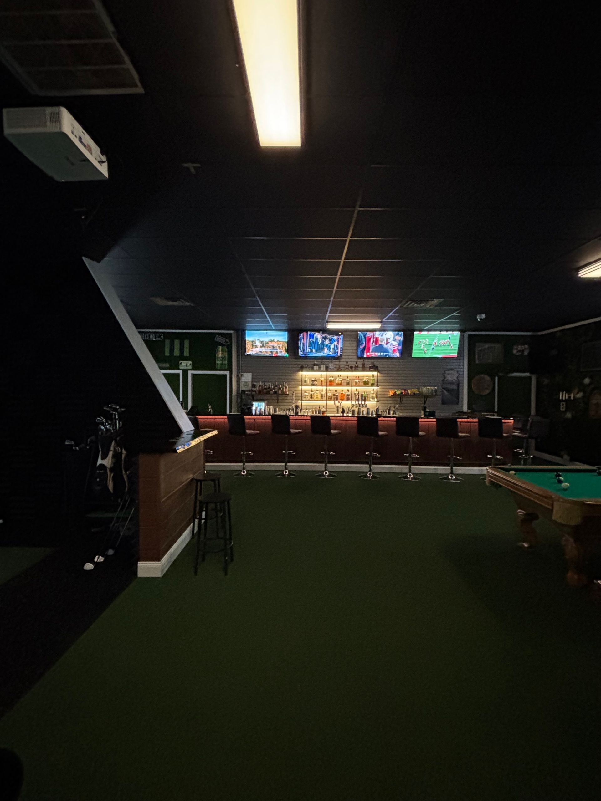 full bar with golf simulators