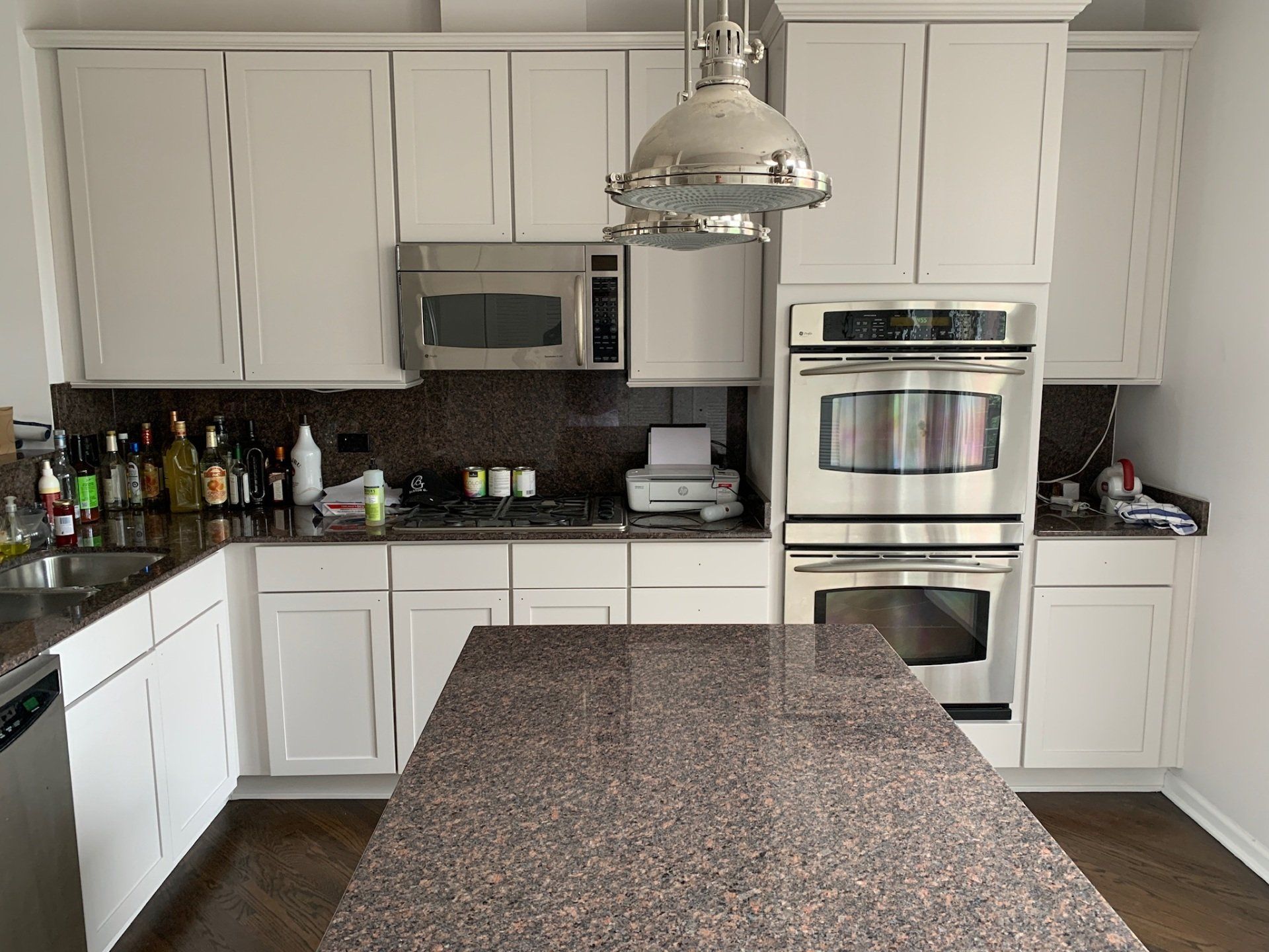 Man Applying Natural Finishes on Wood Surface — Northbrook, IL — Bill Schneeberger Paint and Decorating