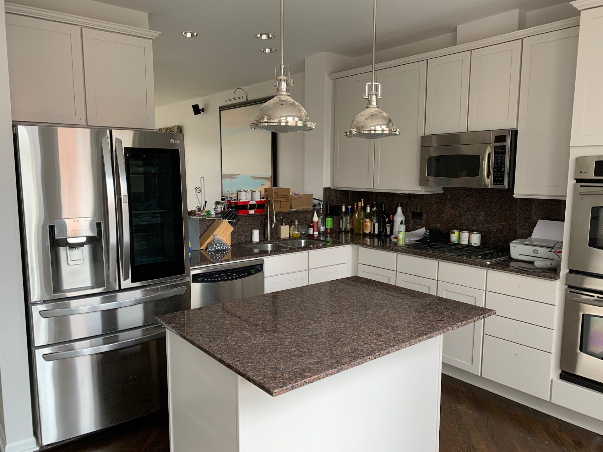 Man Fixing the Flooring — Northbrook, IL — Bill Schneeberger Paint and Decorating