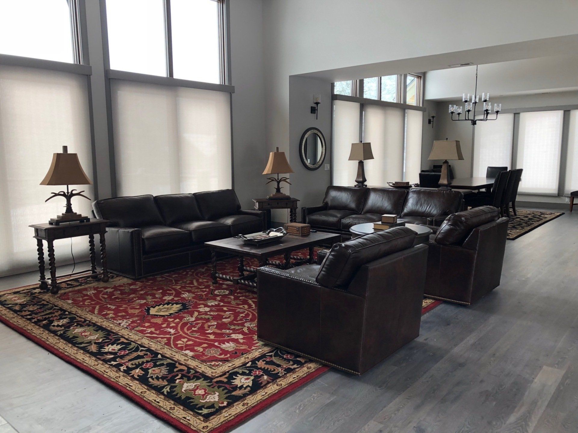 A living room filled with furniture and a rug