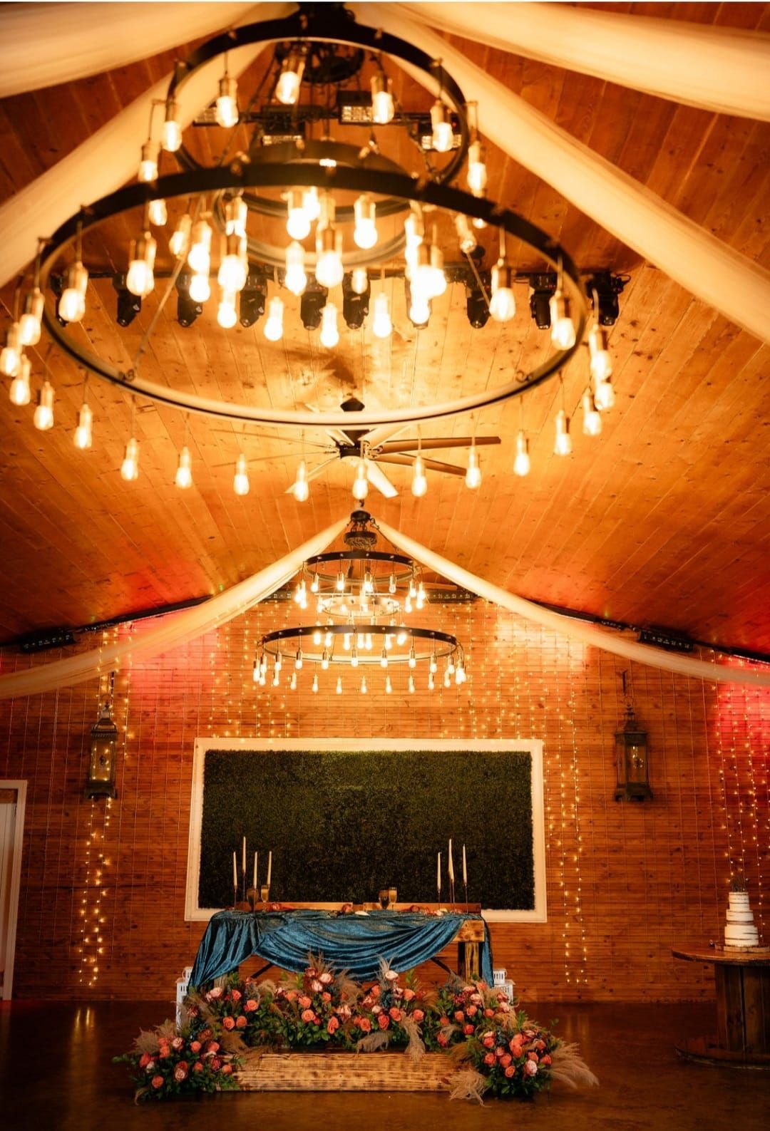 A large chandelier is hanging from the ceiling of a room.