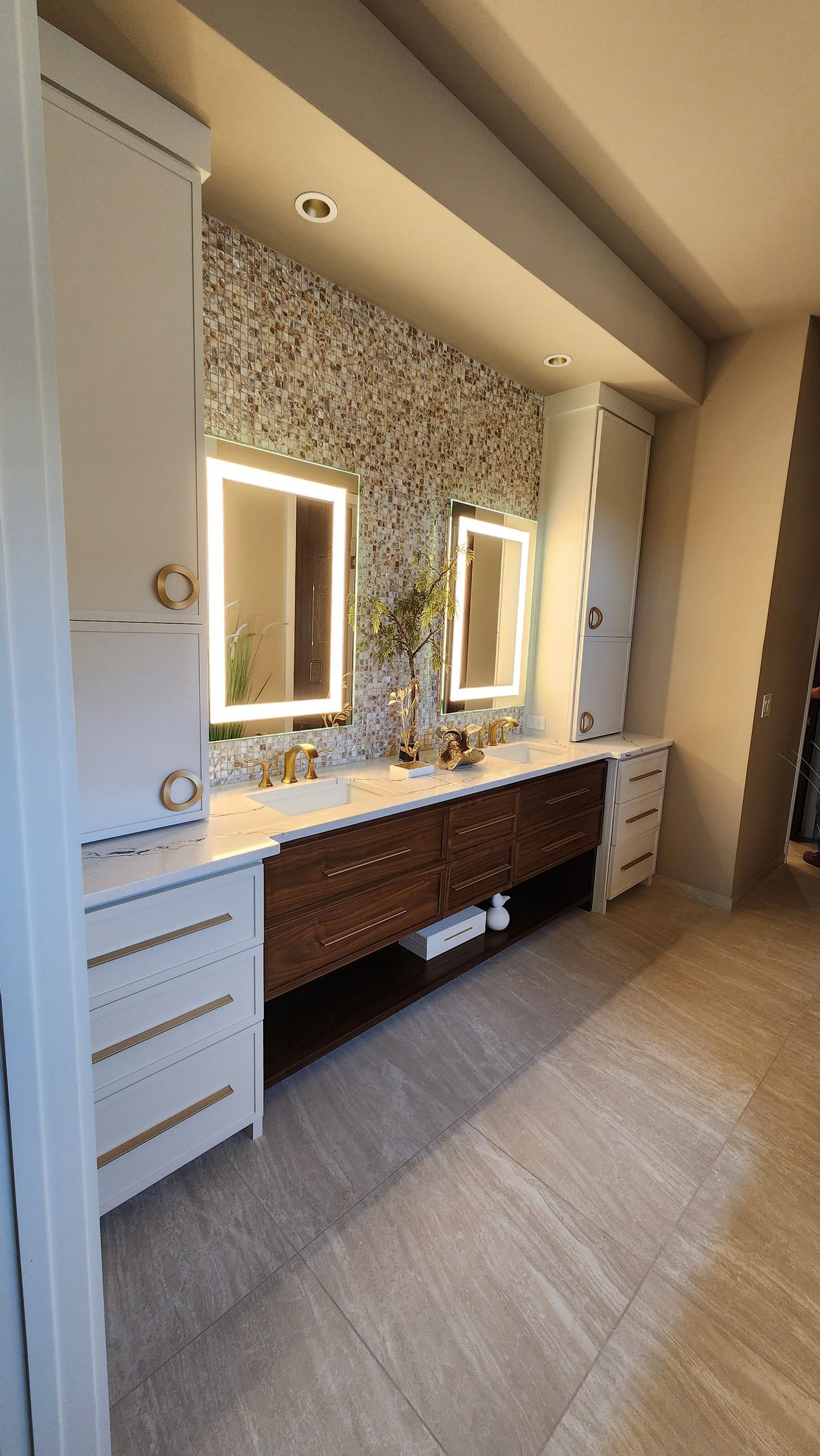 A bathroom with two sinks and two mirrors.