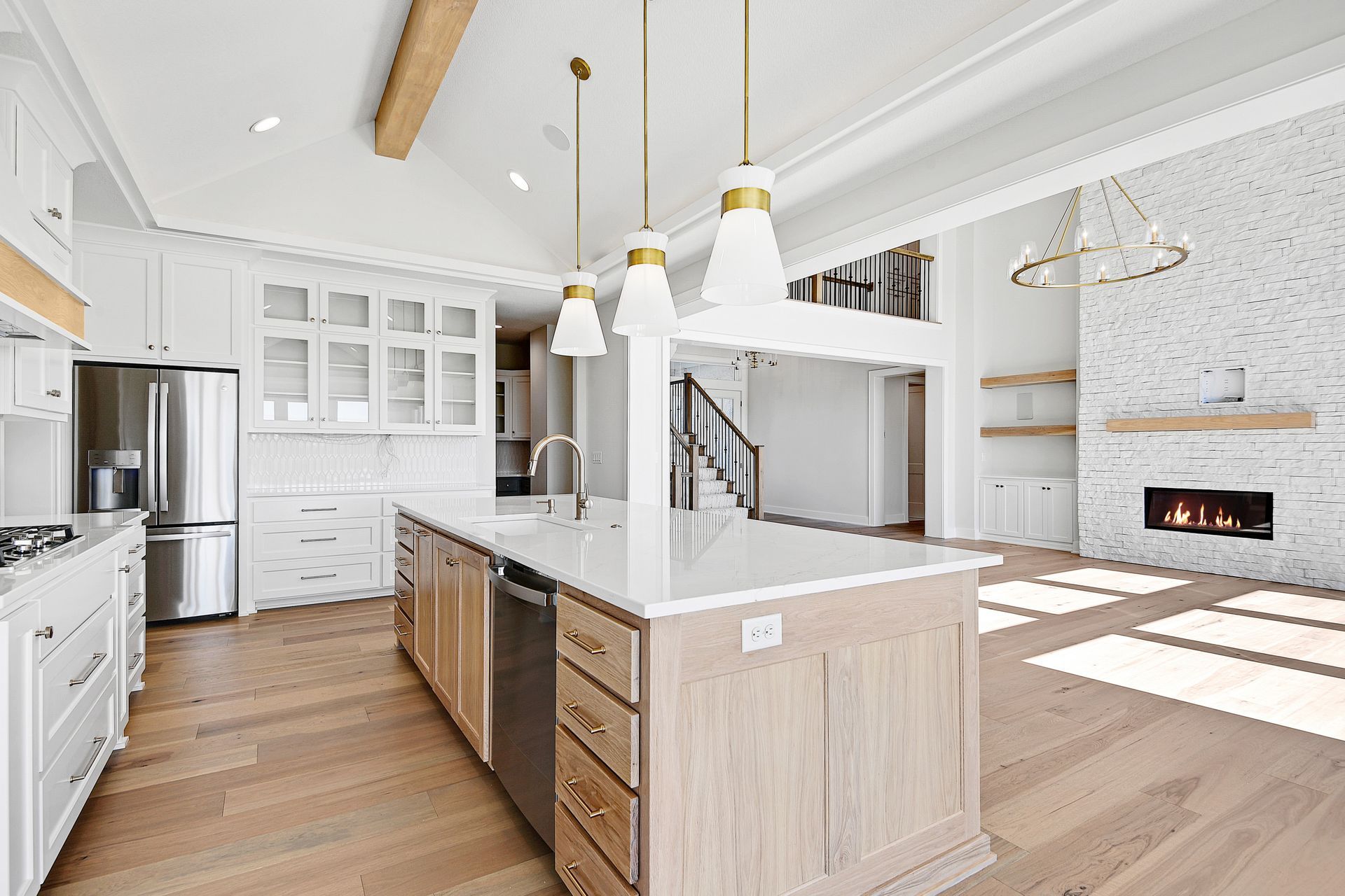 There is a large island in the middle of the kitchen.