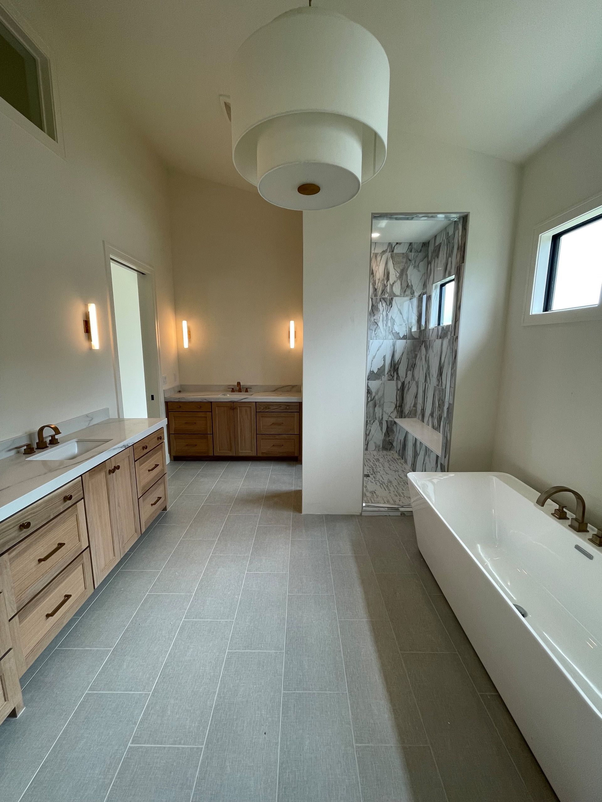 There is a bathtub in the middle of the bathroom.