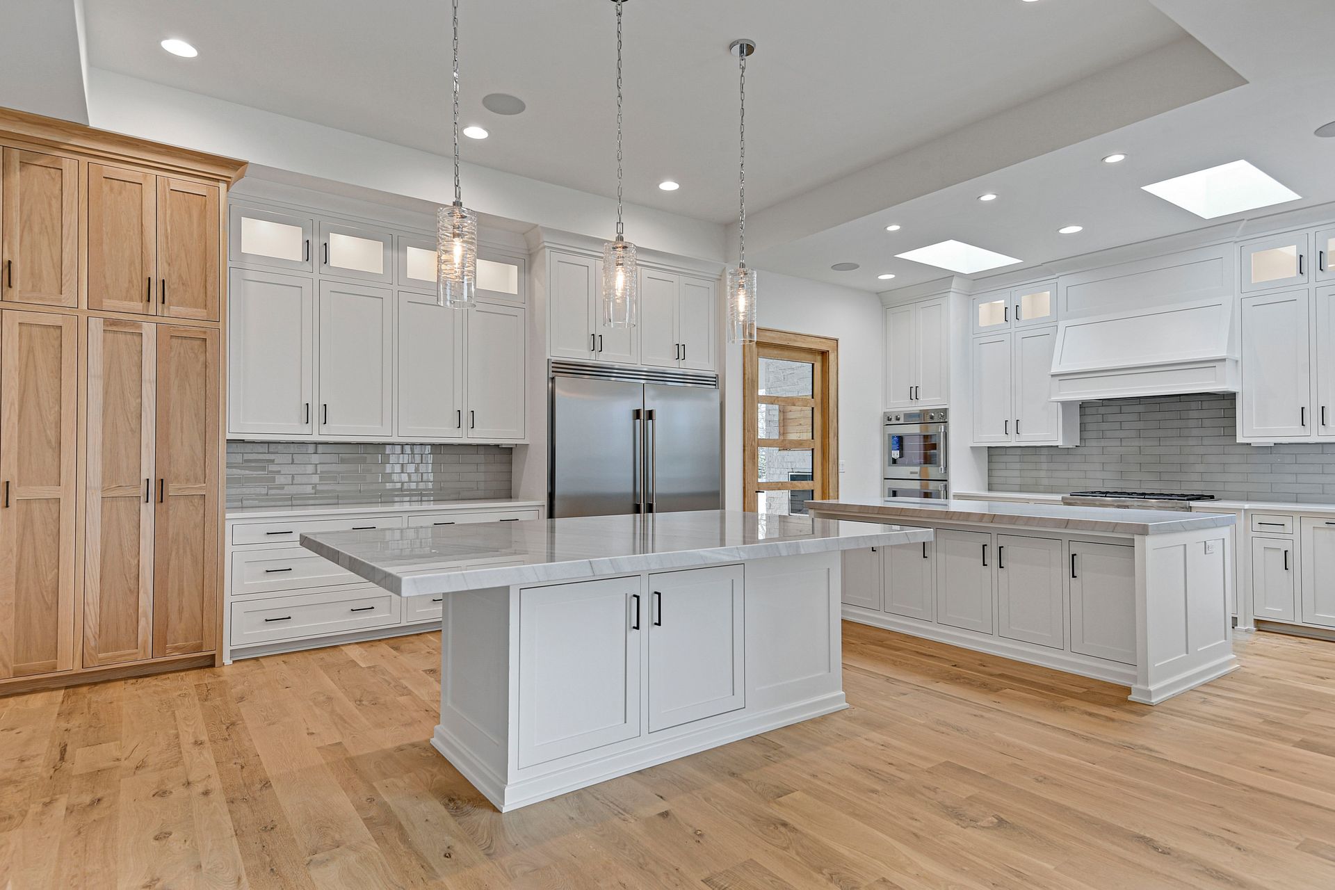 There is a large island in the middle of the kitchen.